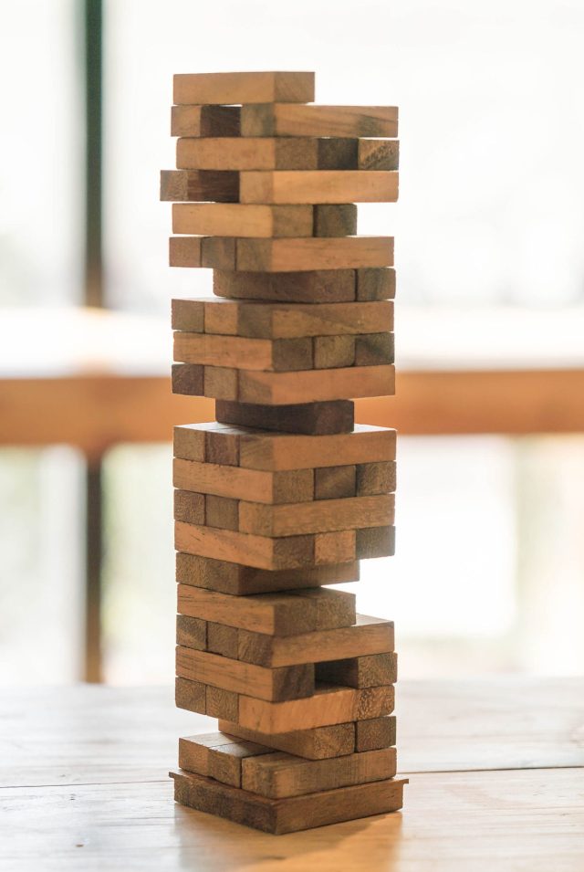 blocks wood game (jenga) on wooden table